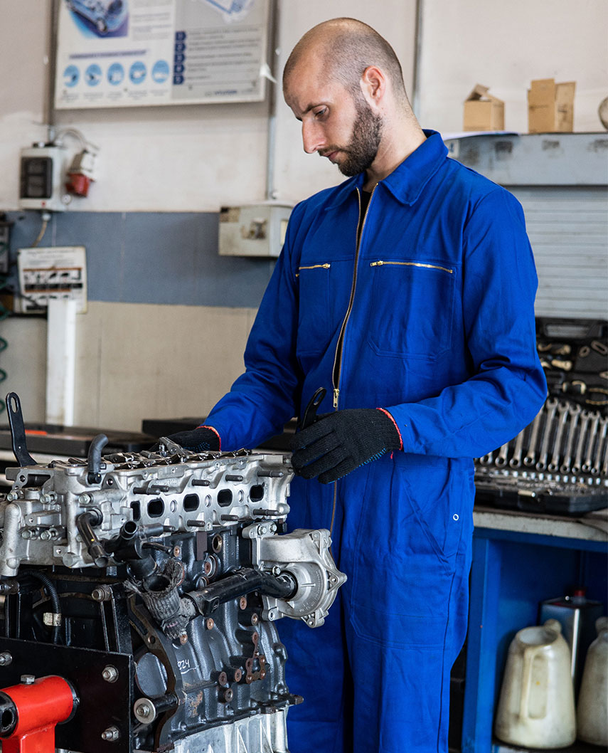 Mechanic Working on Engine
